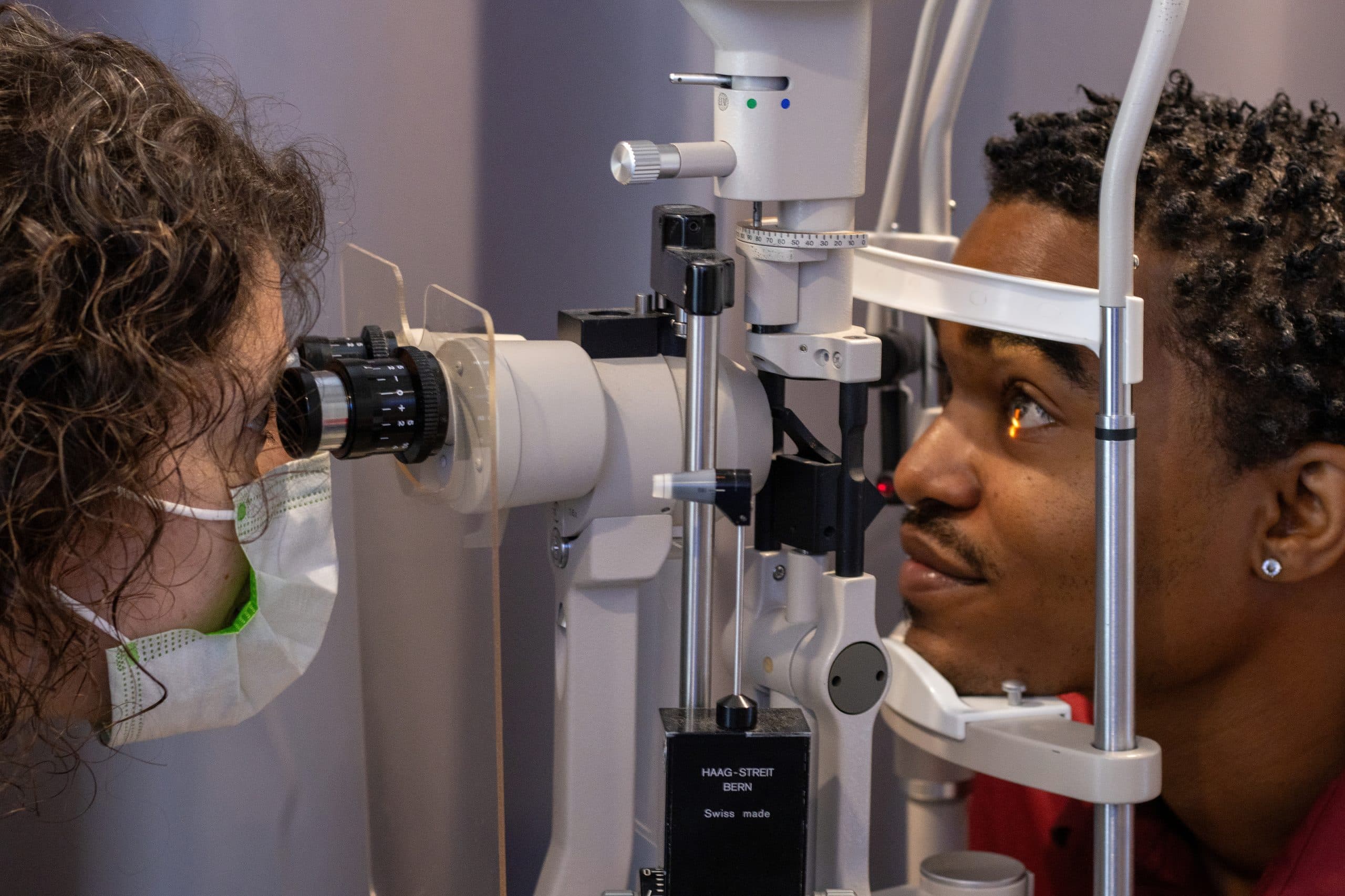 Optometrist performing an eye examination
